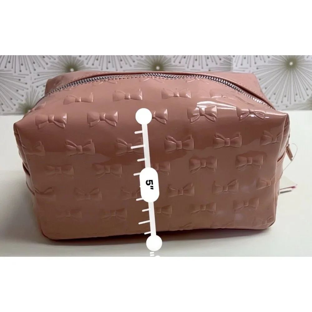Betsey Johnson embossed patent travel/cosmetic bag in blush pink. NWT.